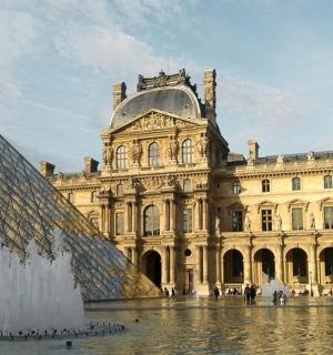a building with a water fountain in front of a building