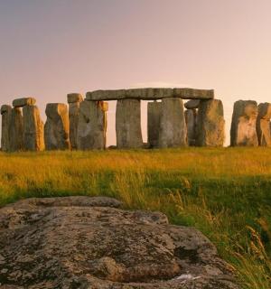 an image of anolith in a field with a rock