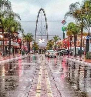 an empty street in a city in the rain