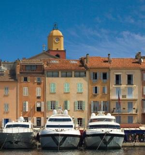 a group of boats docked in front of a building