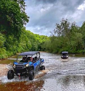 a group of people in a boat in a river
