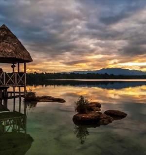 a lake with a gazebo in the middle of the water