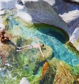 two people swimming in a body of water