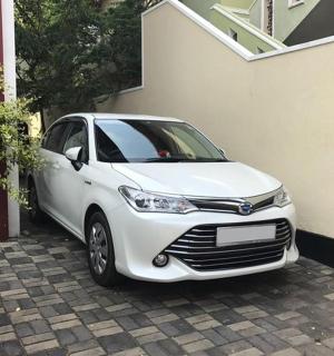a white car parked next to a building