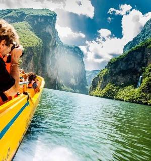 a group of people riding on a boat in the water