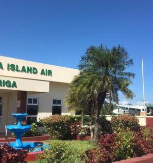 a building with a blue fountain in front of it