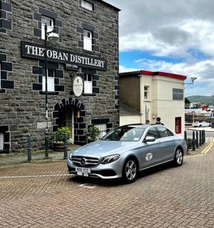 a car parked in front of a brick building
