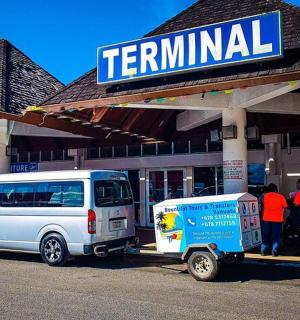 a van parked in front of a terminal gas station