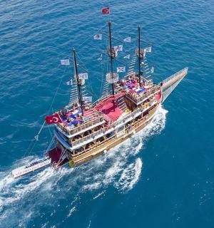 a boat with people on it in the water