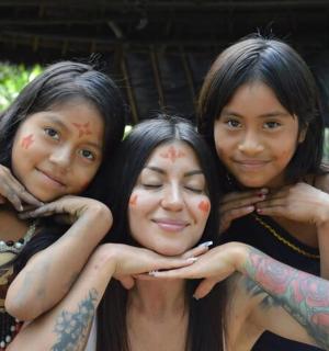 a group of three girls with tattoos on their faces