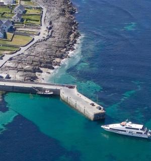 a boat is docked next to a dock in the water