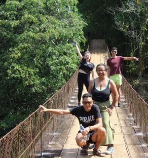 a group of people on a suspension bridge