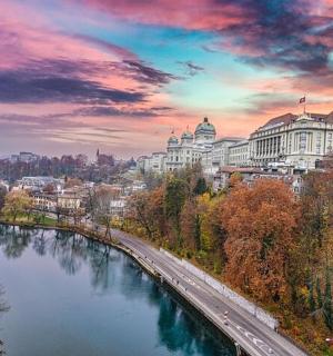 a view of a city with a river and buildings