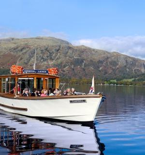 a group of people on a boat on a lake