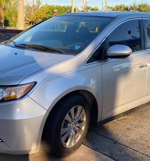 a silver car parked in a parking lot