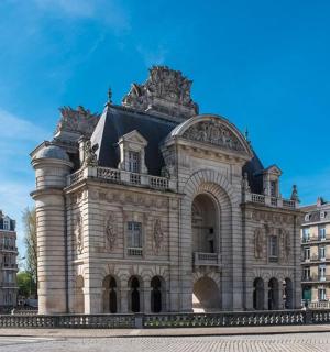 a large stone building in front of a building