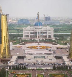 a view of a city with tall yellow towers