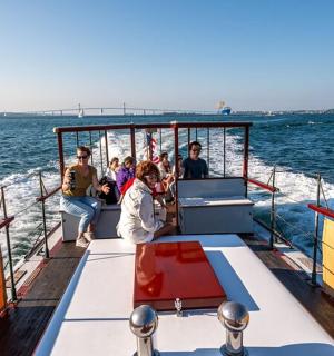 a group of people on a boat in the water