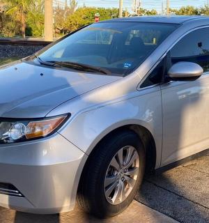 a silver car parked in a parking lot