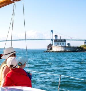 a man and a woman on a boat in the water
