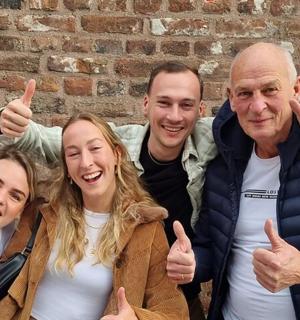 a group of people giving the thumbs up