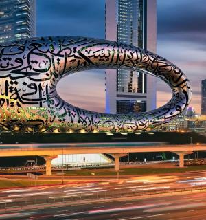 a large sculpture in the middle of a city at night