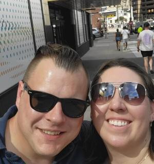 a man and a woman wearing sunglasses posing for a picture