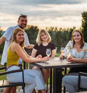 a group of people sitting at a table