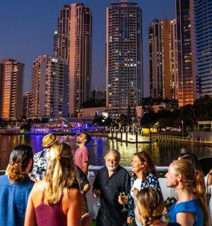 a group of people standing in front of a city skyline