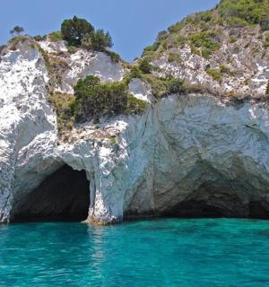 a cave in the side of a rocky mountain