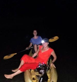 a man and a woman riding on a raft