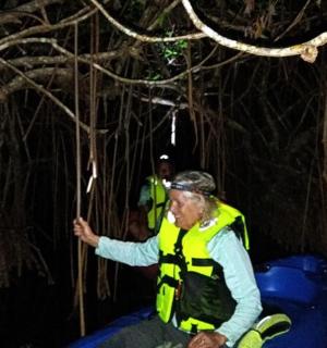 a man in a safety vest sitting on a raft
