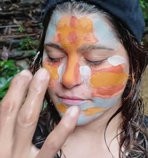 a woman with a face painting on her face