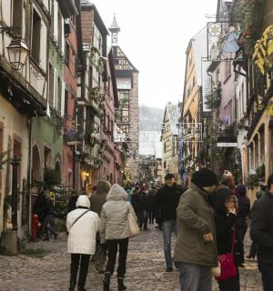a group of people walking down a street