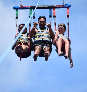 a group of people riding on a swing