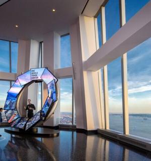 a room with a large mirror in a building with windows
