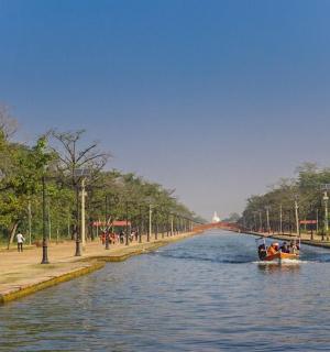 a boat in a river with people on it