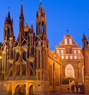 a large building with two towers at night