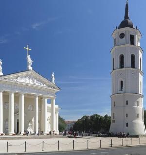 a building with a clock tower in front of a building