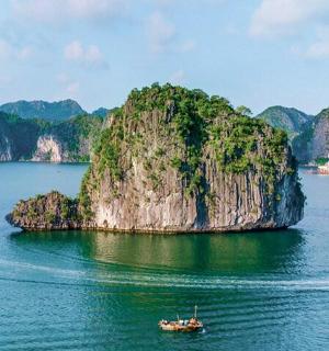 a small island in the water with a boat