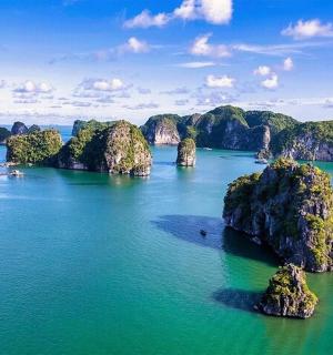 an aerial view of a bay with rocks in the water