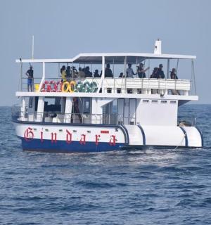 a boat filled with people on the water