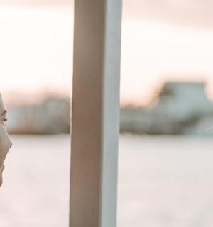 a man and a woman looking out of a window