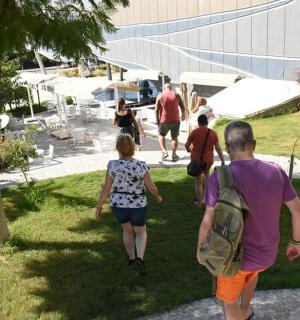 a group of people walking through a park