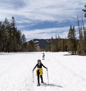 a woman is cross country skiing in the snow