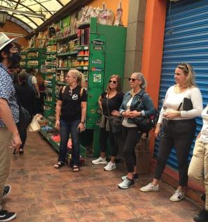 a group of people standing in a store aisle