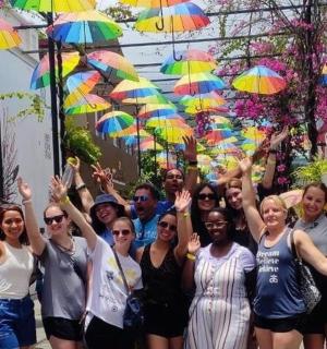 a group of people with their hands in the air