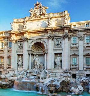 a building with a fountain in front of it