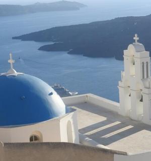 a building with a blue dome and a church