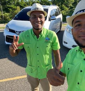 two men in hats standing in a parking lot